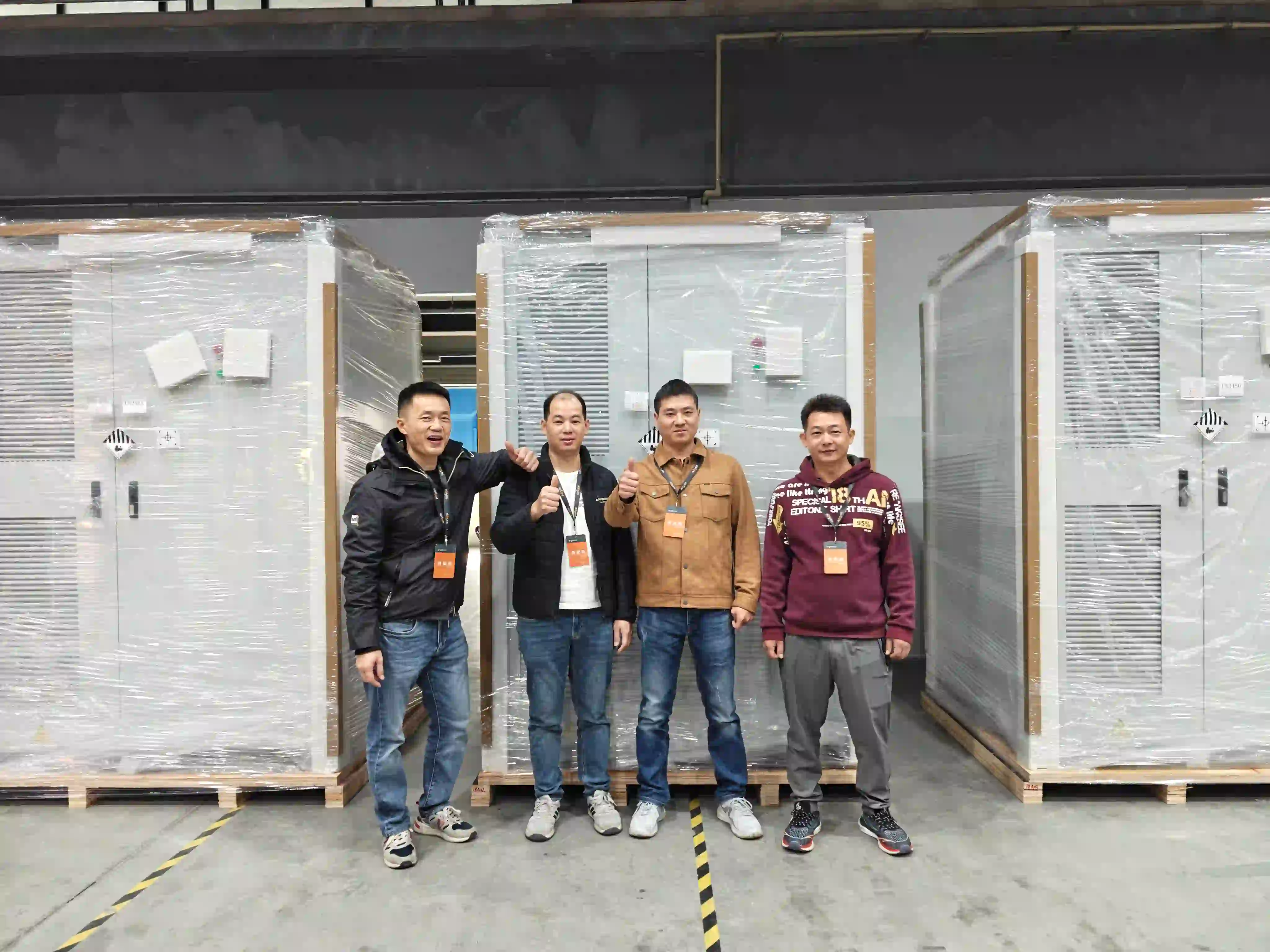 Elecod employees take photo with 215kW418kWh Energy Storage Systems.jpg