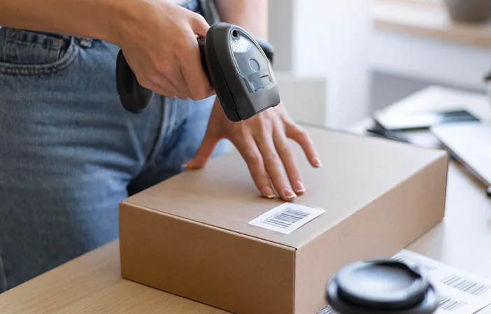 close-up-hand-holding-scanner.png