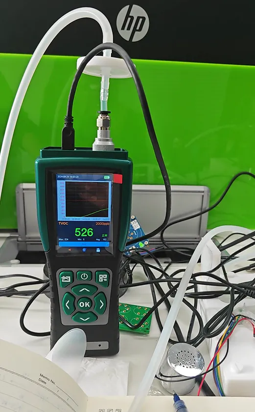 Portable VOC Detector on a lab desk testing acetone C3H6O gas via an external sampling hose