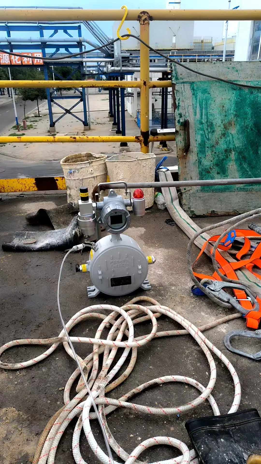 Portable Pump Gas Detector with remote sampling hose on an elevated chemical plant platform