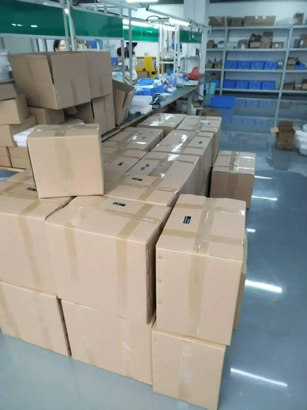Stacks of securely taped cardboard boxes containing gas detectors ready for shipment in the Skyeaglee factory
