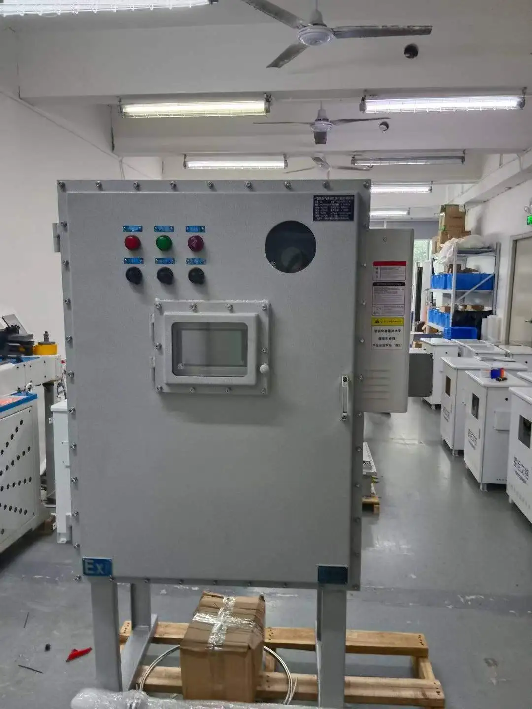 Heavy-duty explosion-proof CO gas analyzer cabinet resting on a wooden pallet in the Skyeaglee manufacturing workshop