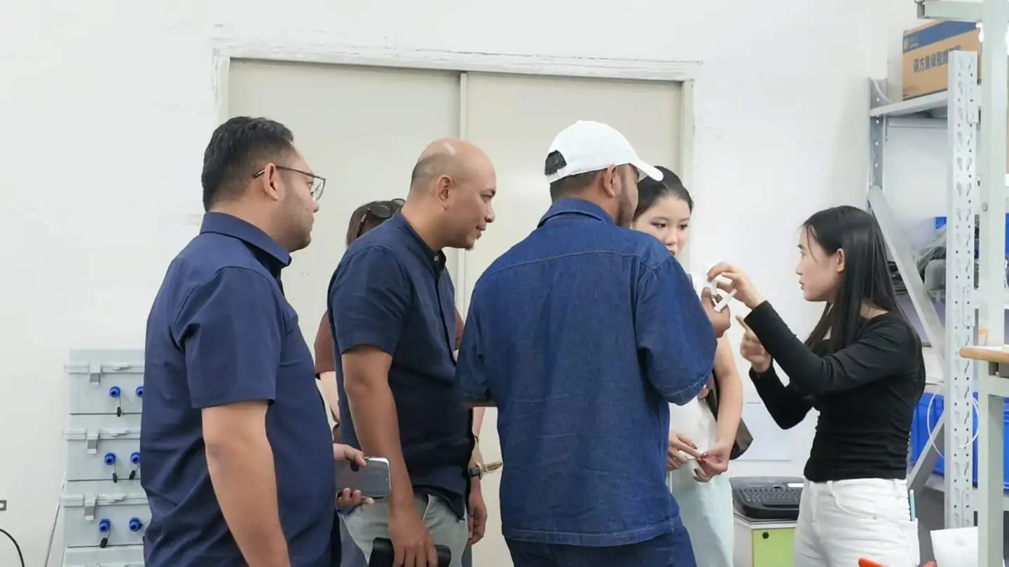 Skyeaglee engineer showing detailed gas sensor components to the visiting Malaysian clients