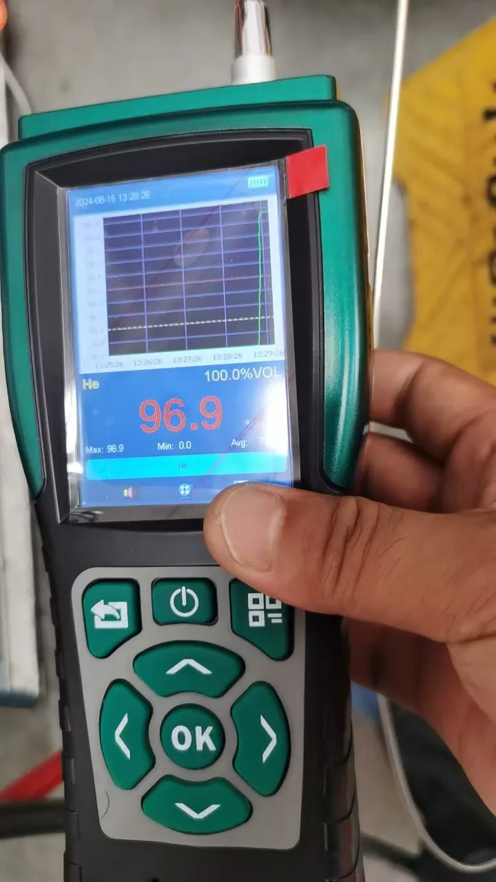 the device’s real-time screen with a 96.9% VOL He concentration reading